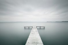 a long dock extending out into the water