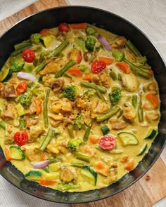 a pan filled with food on top of a wooden table