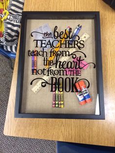 the best teacher is teach from the heart to the book cross stitch pattern in black frame