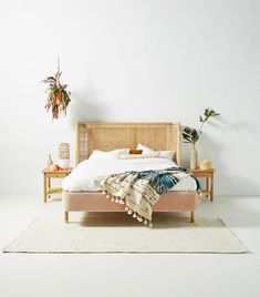 a bed sitting on top of a white rug