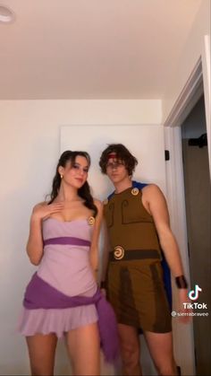 two people in costumes standing next to each other