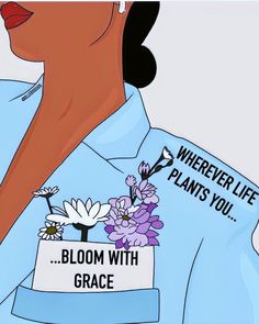 a woman wearing a blue shirt with flowers on it and the words, wherever life plants you bloom with grace