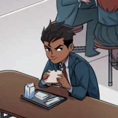 a man sitting at a table with a cat in his lap and another person standing behind him