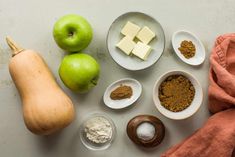 apples, butter, and other ingredients are arranged on a table