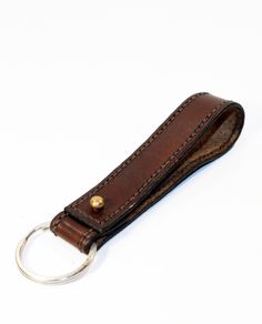 a leather keychain with a metal ring