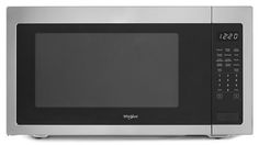 a stainless steel microwave oven with the door open and timer on it's side