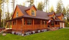 a large log cabin home in the woods