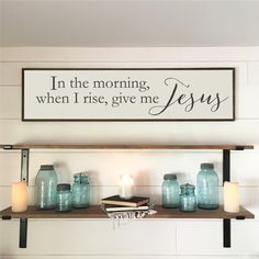 a shelf with candles and jars on it in the morning when i rise, give me jesus