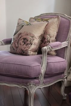 a purple chair with two pillows on it and the caption love the color of this bergre chair