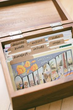 a wooden box filled with lots of cards