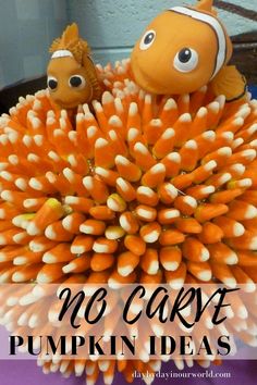 an orange and white decoration with two clown fish on top of it, the words no carve pumpkin ideas