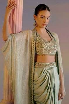 Mint green cape with zari, cutdana, bead and mirror embroidered border. Paired with embellished padded blouse and waistband embroidered draped dhoti skirt. - Aza Fashions Traditional Draped Sets For Festive Occasions, Traditional Draped Festive Sets, Festive Draped Traditional Sets, Festive Traditional Draped Sets, Festive Draped Sets For Festivals, Festive Draped Sets With Zari Work, Festive Draped Designer Sets, Traditional Draped Choli For Party, Festive Draped Set With Unstitched Blouse