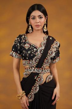 Black georgette saree with multi colored floral and mirror work embroidery on scalloped border. Comes with matching embroidered padded blouse and a belt. - Aza Fashions Multicolor Embellished Pre-draped Saree For Festive Occasions, Embellished Multicolor Pre-draped Saree For Festive Occasions, Festive Multicolor Embellished Pre-draped Saree, Embellished Multicolor Saree In Georgette, Multicolor Embellished Georgette Saree, Embellished Multicolor Saree For Navratri, Multicolor Georgette Blouse With Mirror Work, Black Georgette Blouse With Mirror Work, Embellished Multicolor Blouse For Festivals