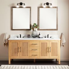 two mirrors are above the double sink vanity