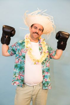 a man wearing a sombrero and boxing gloves