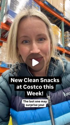 a woman in a blue puffy jacket with the words new clean snacks at costo this week