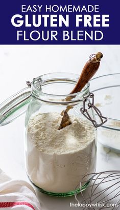 a glass jar filled with cake mix and a whisk sticking out of it