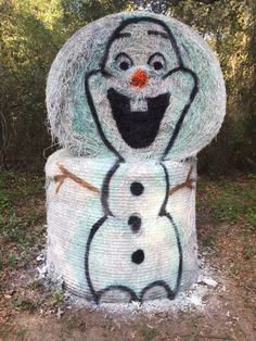 there is a snowman made out of hay