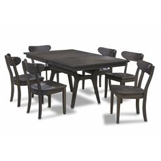 a dining table with six chairs around it