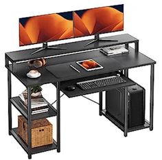 the computer desk has two monitors on it