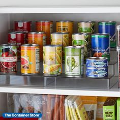 canned food items on shelves in a refrigerator