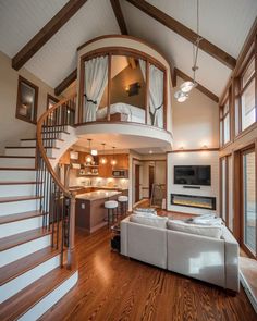 a living room filled with furniture and a spiral staircase