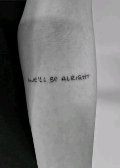 a woman's arm with the words we'll be alright tattooed on it