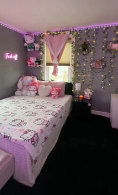 a bedroom with hello kitty bedding and lights