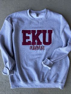 These custom letter sweatshirts are perfect! Customize with your abbreviation! Also customize with your team colors to match!   Sweatshirts are unisex!  ❗️Sizes:  Adult S-4XL If you would like to customize the shirt color, thread color, letters (3) please add to the personalization section!  To order a short or long sleeve tee, feel free to send us a message!  If you would like to request a custom order, please send us a message!! Eastern Kentucky University, Kentucky University, Eastern Kentucky, Letter Shirt, College Shirt, Letter Sweatshirt, College Shirts, University Sweatshirts, Alma Mater