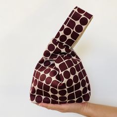 "Introducing our adorable and playful Japanese Knot Bag - the perfect accessory for carrying your essentials in style!  Made from high-quality heavyweight fabric and lined with soft cotton for added durability. The unique knot design allows you to easily wrap the bag around your wrist, keeping your hands free while on-the-go.  Perfect for holding cellphones, keys, wallets, and other small items, this bag is a must-have for anyone who wants to add a touch of fun and functionality to their outfit.  Its compact size and lightweight construction make it easy to take with you wherever you go, whether you're running errands or meeting up with friends.  Experience the fun and functionality of our Japanese Knot Bag for yourself and elevate your daily essentials to a new level of style and convenie Friends Experience, Grocery Basket, Simple Bag, Japanese Knot Bag, Knot Bag, Bag Minimalist, Bento Bags, Eco Bags, Modern Bag