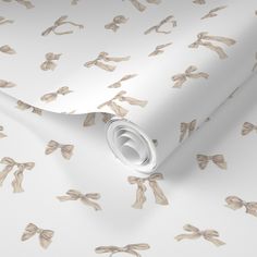 a white wallpaper with bows and ribbons on it's side, as well as the background