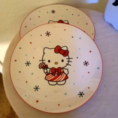 two plates with hello kitty designs on them