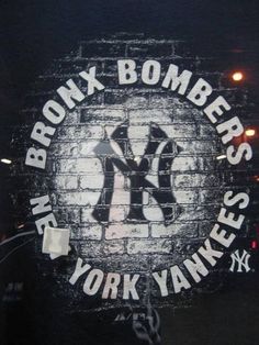 the new york yankees logo on a brick wall