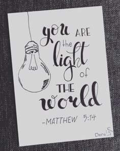 a piece of paper with the words you are the light of the world written on it