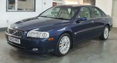 a blue car is parked in a garage