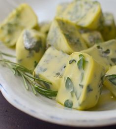 cheese cubes with herbs on a white plate