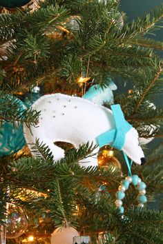 an ornament is hanging on the christmas tree