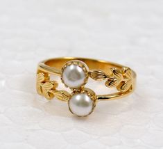 Two Pearls Ring for close bonding of two 2 hearts,Lovers,Twins,Sisters,Friends or Mother and Daughter.Fresh Water Pearls Ring with two leaves holding the bonds with the beauty of nature .They are handmade by artisan in solid sterling 925 silver and gold plated.Awesome wedding Ring,Engagement ring or a Promise ring.A perfect ring for Christmas for your sister,daughter or your mother. Sku - MR1448 Style:- Ring  Gemstone:- Pearl  Metal: 92.5 % Solid Sterling Silver Weight:-2.9g Stone Size:-5x5mm  S Twins Sisters, Pearls Ring, 2 Hearts, Mother Day Gift, Freshwater Pearl Ring, Ring Wedding Band, Leaf Ring, Wedding Band Ring, Labradorite Ring