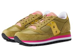 Saucony Originals Jazz Triple - Women's Shoes : Olive/Gold : Stretch your legs and feet in the comfort of the Saucony Originals Jazz Triple sneaker. Textile and synthetic upper. Lace-up closure. Round-toe silhouette. Textile lining and insole. Synthetic outsole. Imported. Measurements: Weight: 10 oz Product measurements were taken using size 8.5, width B - Medium. Please note that measurements may vary by size. Cushioned High-top Sneakers For Jogging With Round Toe, Cushioned Round Toe High-top Sneakers For Jogging, Running Sneakers With Contrast Sole And Round Toe, Running Sneakers With Contrast Sole, Slip-on Sports Running Shoes With Contrast Sole, Sporty Nylon Low-top Slip-on Sneakers, Slip-on Running Shoes With Contrast Sole For Sports, Sporty Nylon Slip-on Low-top Sneakers, Sporty Low-top Nylon Slip-on Sneakers