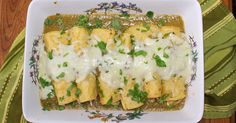 an enchilada dish is shown on a plate