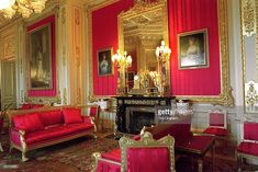 an ornately decorated room with red and gold furniture