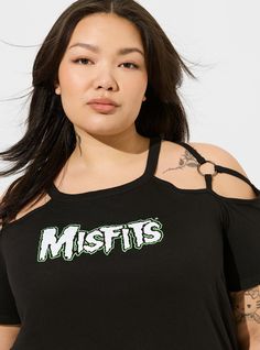 FIT Classic fit: Fitted up top, eased through the body. Measures 24” from shoulder (size 2). MATERIALS + CARE Cotton-blend knit fabric. . 60% cotton, 40% polyester. . Machine wash cold. Tumble dry low. Imported. DETAILS Crew neckline. . Short sleeves. Misfits graphic print. The best plus size women's misfits classic fit cotton o-ring cold shoulder tee graphic tees in deep black made of cotton/polyester. Rock your look from Torrid to Festivals like Coachella and Lollapalooza, a concert, a show, o Fitted Wedding Dress, Summer 24, Bra Cups, O Ring, Crew Neckline, Cold Shoulder, The Body, Knit Fabric, Size 2