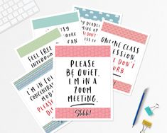 four different types of greeting cards sitting next to each other on a white table with a keyboard and pencil