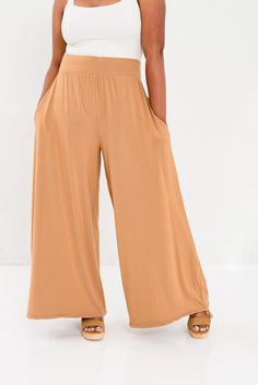 Slip into buttery soft comfort with sophisticated style in The Vietnam wide leg, tie bottom. Made with the same eco friendly, anti-bacterial and odor resistant bamboo fabric that we make the Everyday Travel Wrap, this pant offers options to the wearer dress up or dress casual options, depending on the situation. Ideal for Travel with optional ties at the bottom hem of the pant, this allows for all day roaming of the streets without having to worry about the bottoms of your pants getting dirty. L Versatile Summer Wide Leg Pants Full Length, Versatile Full Length Wide Leg Pants For Summer, Versatile Full Length Summer Wide Leg Pants, Chic Wide Leg Pants With Tie Waist, Versatile Wide Leg Solid Culottes, Versatile Solid Bottoms With Tie Waist, Chic Modal Bottoms For Loungewear, Spring Loungewear Pants With 4-way Stretch, Versatile Solid Color Wide-leg Culottes