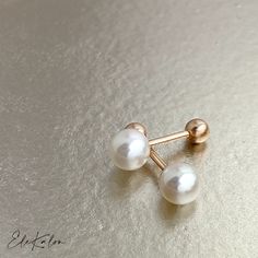 Dainty Pink Tint Genuine Japanese Akoya Pearl 18K Gold Screw back earrings  * Akoya Pearl size: Choice of 3.5-4mm/4.5-5mm/5.5-6mm/6.5-7mm * Screw back gold ball: approx. 3.5mm * Bar thickness: approx. 0.85mm * Metal: 18K Solid Gold choice of Yellow or Rose * Sold as Single or A Pair * Stamp: 18K 📌Production time: If in stock, will ship in 3-5 business days. Usually production time around 2-3 weeks, sometimes can take 3-4 weeks. ❤️Visit our official website for exclusive new products.      https://elekalonjewelry.com/ ❤️Follow us on Instagram @ elekalonjewelry for the latest projects and much more! ❤️If you have any questions, please feel free to message us. Elegant White Cartilage Earrings For Anniversary, White Screw Back Earrings For Gift, Classic White Cartilage Earrings As Gift, Elegant White Round Cartilage Earrings, Elegant White Cartilage Earrings Gift, Dainty Gold Earrings, Akoya Pearl Earrings, Helix Earring, Jewelry Appraisal