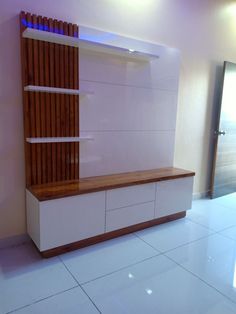 a white and wooden entertainment center in a room