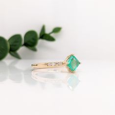 This bright glowing green ring features a 0.52-carat Asscher cut emerald with natural earth-mined diamonds, all set in solid 14K gold. This ring can be a beautiful May birthstone gift for your loved ones! This ring is made with solid 14K Gold and naturally Earth-mined SI / G-H diamonds. As listed, this ring is ready to ship. If you're interested in purchasing this setting with a different center stone please message us! 14k Gold Green Diamond Princess Cut Ring, Green Princess Cut Diamond Ring In 14k Gold, Princess Cut Green Diamond Ring In 14k Gold, Green Diamond Ring With Princess Cut And Accent Stones, Green Princess Cut Diamond Ring With Accent Stones, Emerald May Birthstone Ring For Proposal, Diamond Ring With Accent Stones For Proposal, Emerald Moissanite Ring With Princess Cut For Gift, Emerald Moissanite Ring Princess Cut Gift