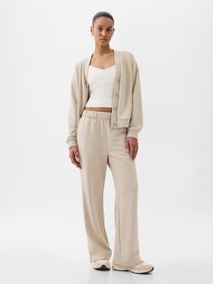 Soft stretch knit straight leg pants.  Elasticized waist.  Front slant pockets.  Mid rise.  Straight silhouette with a roomy fit.  Wide leg.  Models wearing Gap Casual Gap Bottoms For Daywear, Casual Everyday Pants By Gap, Gap Tapered Leg Everyday Pants, Gap Everyday Straight Leg Pants, Gap Tapered Leg Pants For Everyday, Versatile Straight Sweatpants For Lounging, Gap Lounge Pants With Ribbed Waistband, Gap Casual Lounging Bottoms, Gap Long Lounge Bottoms