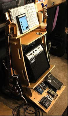 an electronic device is sitting on top of a guitar stand