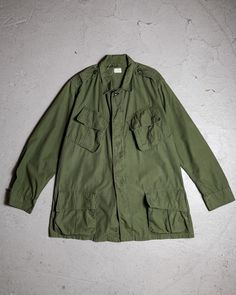 1960's Vintage US Army 2nd Type Junle Jacket  SIZE MR Shoulder：46cm Pit to pit：60cm Length：79cm Sleeve：60cm  Welcome to our online store https://bansecondhandgoods.com/ Worldwide Shipping The official website provides credit card services,  please contact us via private message if necessary. Find us IG :  ban_secondhand_goods Thank you for checking us out :) Vintage Green Utility Jacket For Work, Retro Utility Jacket With Patch Pockets, Vintage Outerwear With Flap Pockets For Work, Vintage Long Sleeve Utility Jacket With Pockets, Vintage Khaki Outerwear With Patch Pockets, Retro Military Outerwear For Fall, Vintage Green Utility Jacket With Flap Pockets, Army Jacket With Patches Vintage, Military Style Nylon Khaki Outerwear